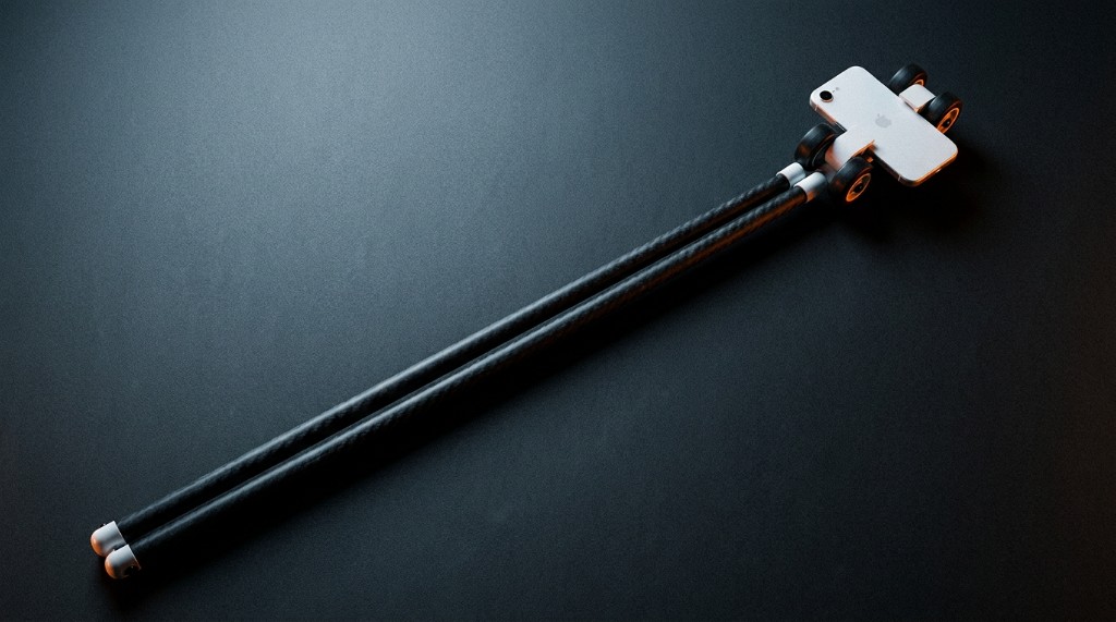 The underbody kit seen from above: two long carbon poles ending in a small wheeled head that carries a phone